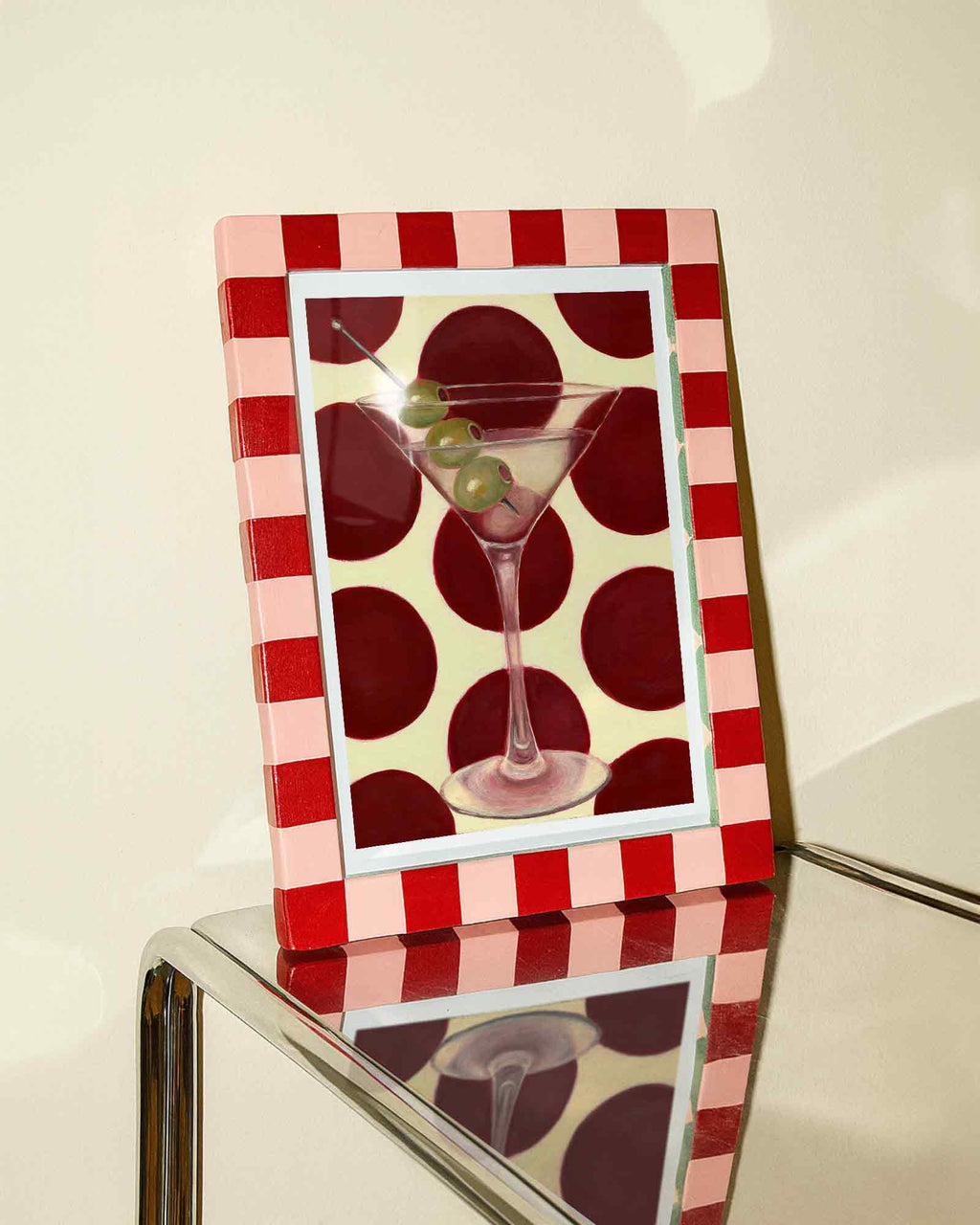 Decorative picture frame with a red and white checkered border featuring a cocktail illustration.