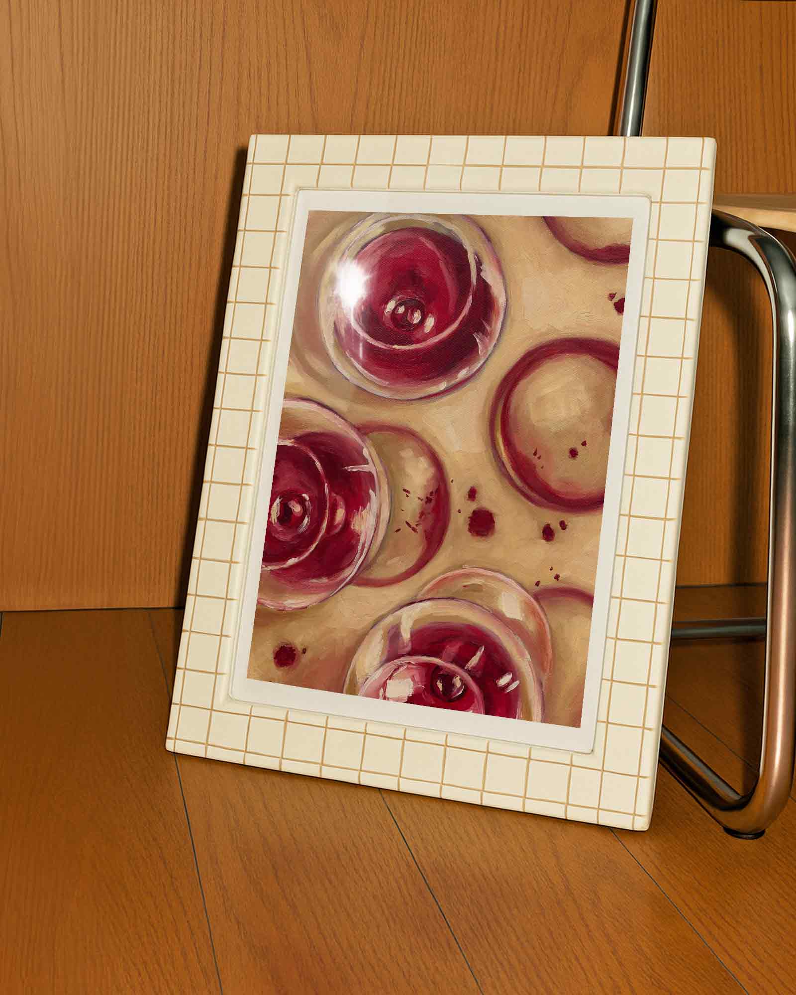 Framed artwork of wine glasses on a wooden background