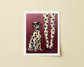 Print of a Dalmatian dog with sunglasses and woman with polka dot tights on a red background